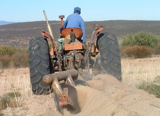 farmer preparing the soil
