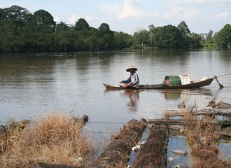 fisherman on the Kampar river, Indonesia