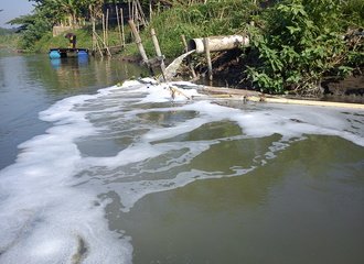 paper industry wastewater pipe in Surabaya river, Indonesia